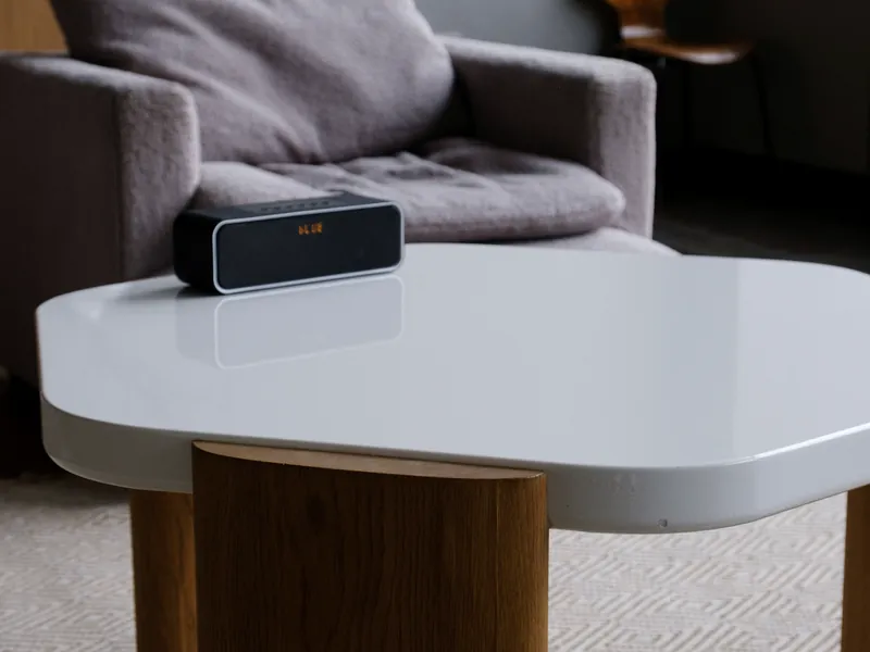 Compact wireless speaker in a quiet modern living room